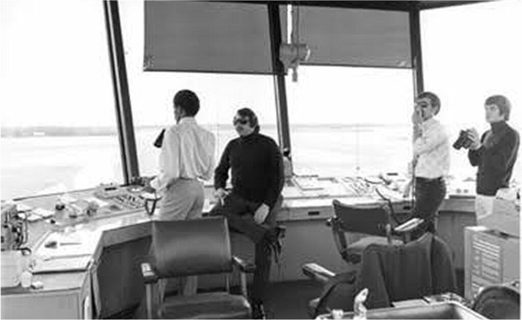 1960s - Photograph of the inside of an airport control tower with four workers